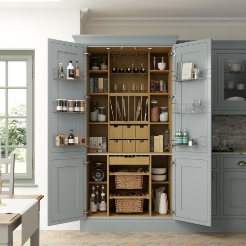 a pale blue kitchen with a classic kitchen pantry within it. A selection of kitchenware is shown within the pantry